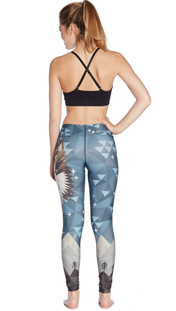 back view of model wearing wolf / dog themed printed full length leggings