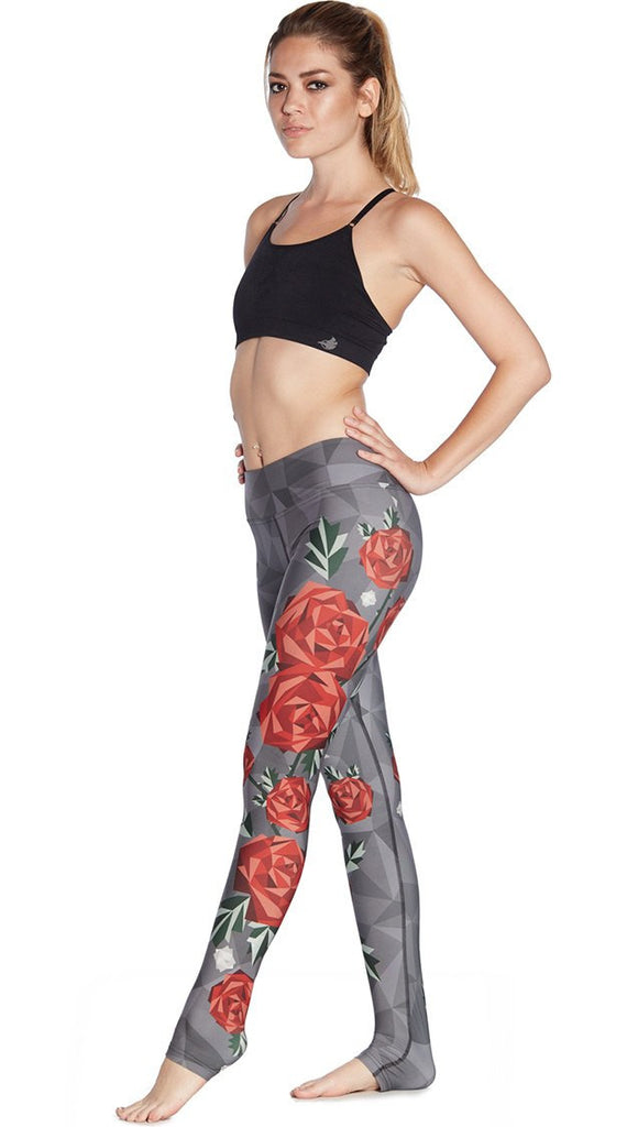 left side view of model wearing polygon roses themed printed full length leggings