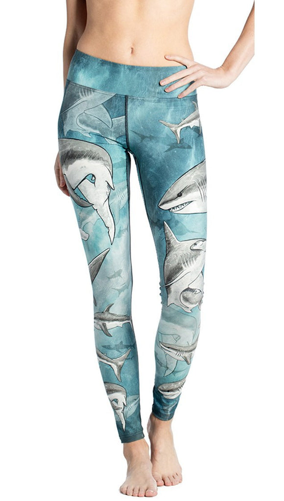 close up front view of model wearing shark themed printed full length leggings