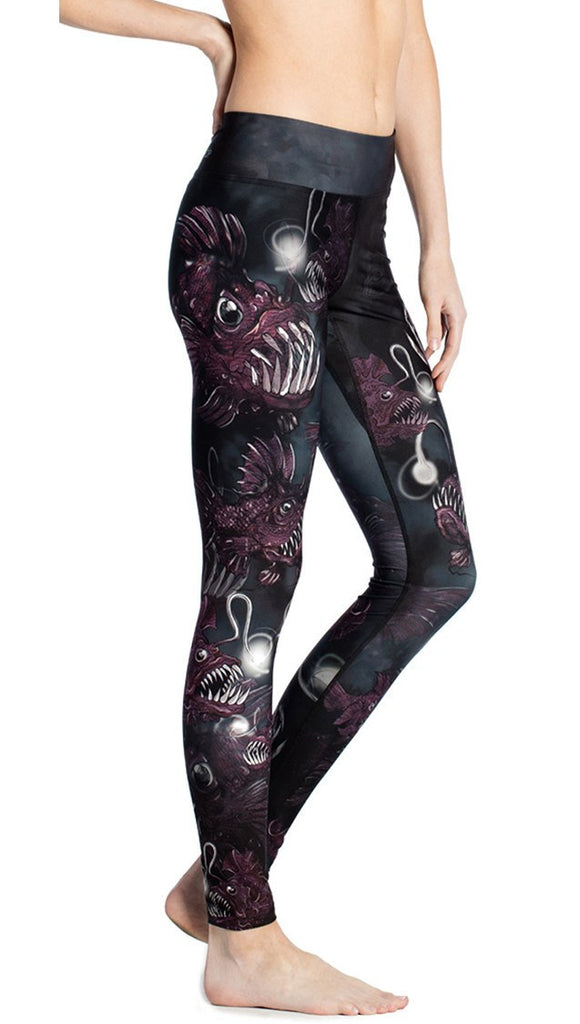 close up side view of deep sea angler fish printed full length leggings