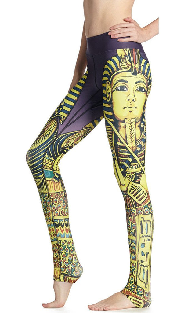 close up left side view of model wearing king tut themed printed full length leggings